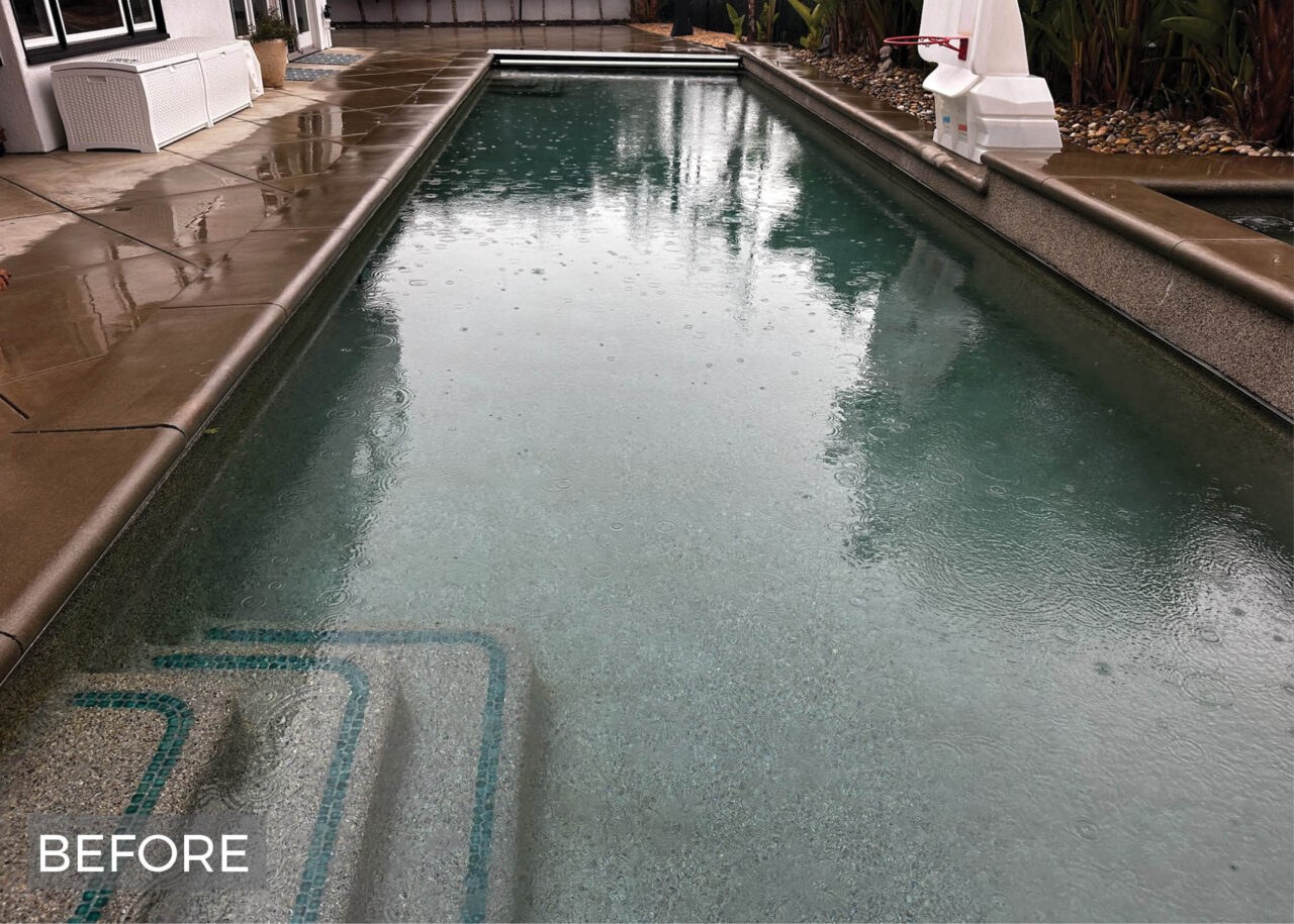 Pool before cleaning, murky rain-covered water