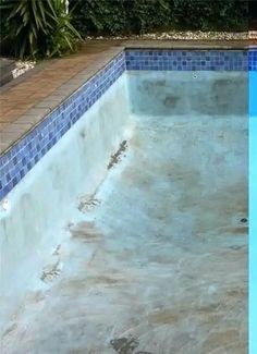 Pool before cleaning, stained and drained